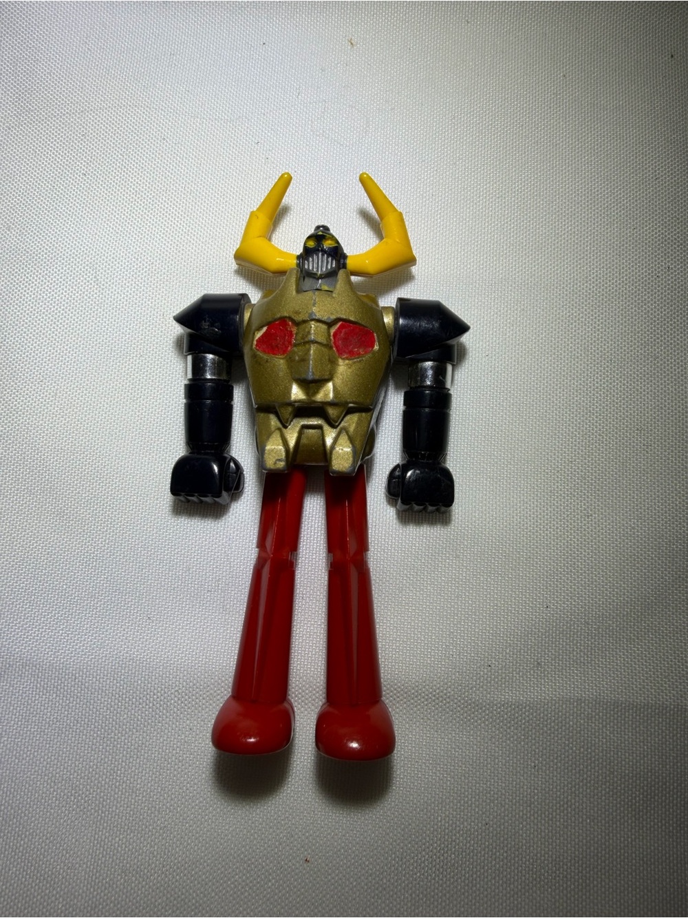 Mattel Gold, Black & Yellow Horned Robot Figure with Red Legs